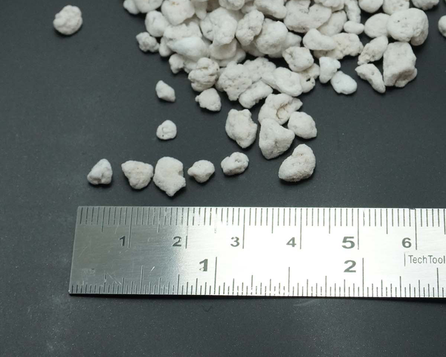 BLACKACRE SUPPLY CO.™ coarse-graded structural aggregate baseline check with scale